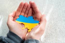 hands holding national flag of ukraine in the shap 2022 03 29 23 49 47 utc